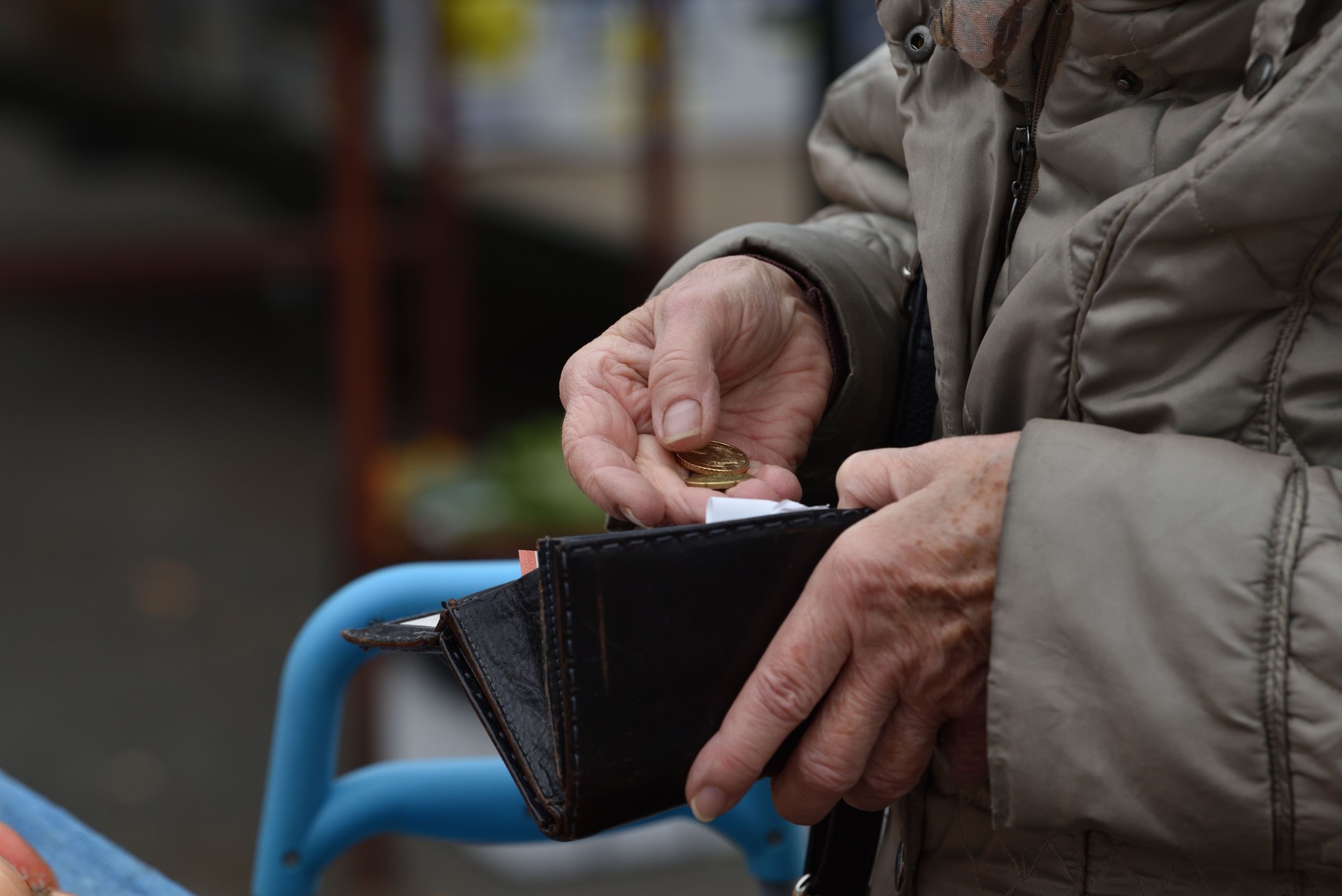 Close-up of paying  with euros.